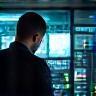 Engineer monitoring network signals.