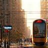 Connected tram and digital signage in city.